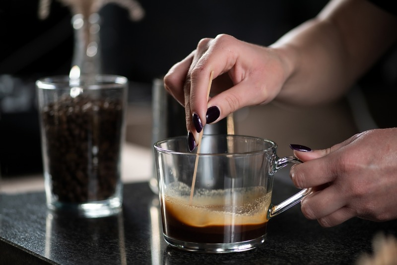 Female,Barista,Expertly,Prepares,Mocha,Coffee,,Mixing,Chocolate,With,Espresso. Female,Barista,Expertly,Prepares,Mocha,Coffee,,Mixing,Chocolate,With,Espresso.